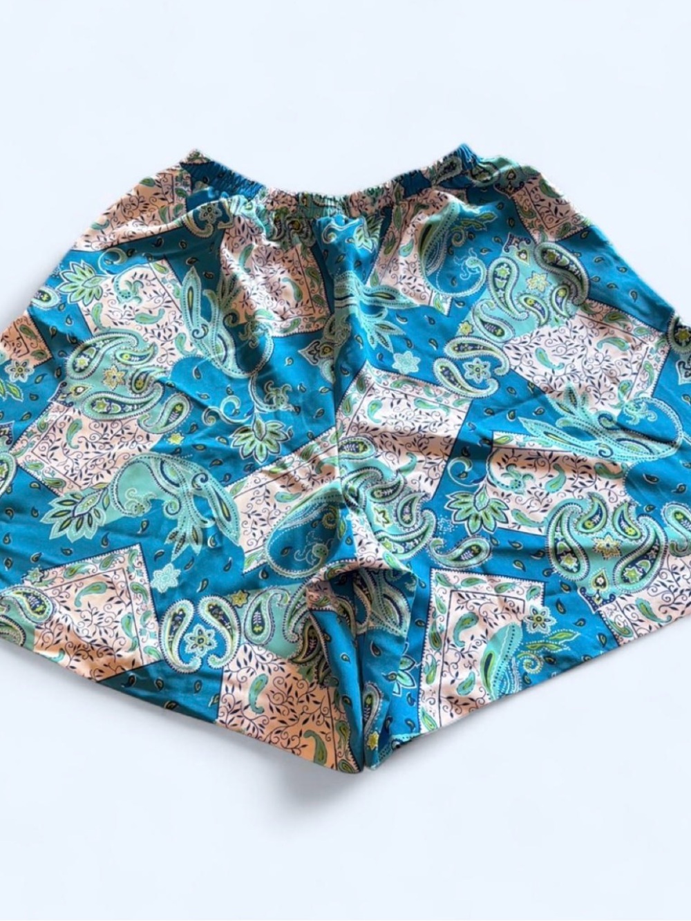 Women’s medium flowy wide leg shorts by Susan Graver. Blue and green paisley.